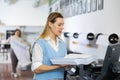 Technician working on plotter and cutter machine in printing shop Royalty Free Stock Photo