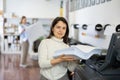 Technician working on plotter and cutter machine in printing shop Royalty Free Stock Photo