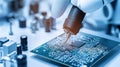 A technician works on a circuit board in a lab, using a precision tool to repair electronic components in a Royalty Free Stock Photo