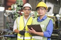 A technician with a wrench, locking pliers and a file. factory workers using machine equipment in workshop. Asian mechanical Royalty Free Stock Photo