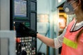 Technicians Caucasian women wearing surgical masks is setting up the system of the machine Royalty Free Stock Photo