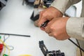 Technicians cutting fiber optic cables. Royalty Free Stock Photo