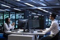Technicians in data center workspace running system diagnostic tests Royalty Free Stock Photo