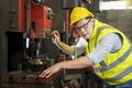 Technicians and engineers are working in a factory with modern machines. Asian man Mechanical Engineer checking equipment in the Royalty Free Stock Photo