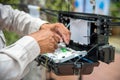 Technicians install cabinet on fiber optic cable. Royalty Free Stock Photo