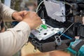 Technicians install cabinet on fiber optic cable. Royalty Free Stock Photo