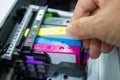 Technicians are install setup the ink cartridge of a inkjet printer the device of office
