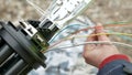 Technicians are installing optic fiber with cable ties. Royalty Free Stock Photo