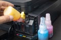 Technicians Refill ink cartridges, printer Inkjet colors.Printer Repairs and Maintenance inkjet or Laser printers concept Royalty Free Stock Photo