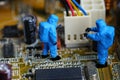 Technicians repair on computer mainboard. Royalty Free Stock Photo