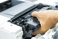 Technicians replacing toner in laser printer concept office supplies