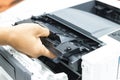 Technicians replacing toner in laser printer concept office supplies