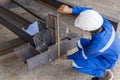 Technicians are using measuring tape to checking the accuracy of the steel structure Royalty Free Stock Photo