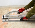 Technicians are using tools to cut tiles in construction. Royalty Free Stock Photo