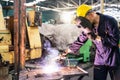 Technicians who specialize in steel cutting and welding. Technicians and engineers are working on machines in a factory Royalty Free Stock Photo