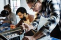 Technicians working on computer electronics parts