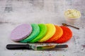 Technique of cake assembly. Frosting and rainbow cake Royalty Free Stock Photo