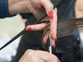 Scissors in hand close-up cut the hair on his head Royalty Free Stock Photo