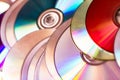 Technological background created with the photo of cd, the light accentuates the reflections coloring them. Royalty Free Stock Photo