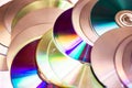 Technological background created with the photo of cd, the light accentuates the reflections coloring them. Royalty Free Stock Photo