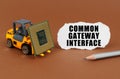 On the table, the loader transports the processor, next to it is paper with the inscription - Common Gateway Interface