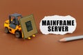 On a brown surface, a forklift is transporting a processor, next to it is paper with the inscription - Mainframe Server