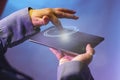 Technological concepts for the future of digital tablets. Touch the tablet screen and issue a wave of light encircling his finger