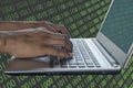 Technological crime hackers use a laptop or notebook to hack high-security computer code to thief the information. Design double Royalty Free Stock Photo