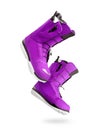 Technological purple snowboard boots on a white