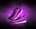 Technological running shoes with a flash of purple light in the dark