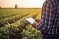 Technological Using tablet digital at agriculture field. Generate Ai