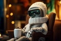Technologies in knitting, Modern humanoid robot with cup in knitted hat and sweater sitting in chair and looking Royalty Free Stock Photo