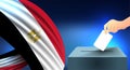 Male hand puts down a white sheet of paper with a mark as a symbol of a ballot paper against the background of the egypt flag, i Royalty Free Stock Photo