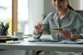 technology, asian woman online shopping concept - happy smiling woman with tablet pc computer and credit card at home Royalty Free Stock Photo