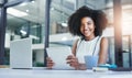 Technology and business go together in todays age. an attractive young businesswoman working in her office. Royalty Free Stock Photo