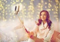 Happy woman taking selfie by smartphone at home Royalty Free Stock Photo