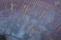 Technology: Close up of a bronze sundial on a carved stone pedestal. 4