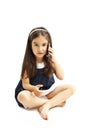 Technology and communication - confused little girl talking on mobile phone smartphone, Misunderstanding.