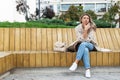 Technology, communication, lifestyle and people concept - smiling young woman or teenage girl calling on smartphone on city street Royalty Free Stock Photo