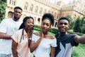 Technology concept. Group of african students taking selfie with phone in campus Royalty Free Stock Photo