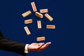 Technology and Customers concept. a man throws up wooden blocks with the words Marketing, Target, Sales, growth, teamwork