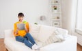 Happy asian woman with tablet pc and apple at home Royalty Free Stock Photo