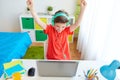 Boy with headphones playing video game on laptop Royalty Free Stock Photo