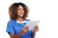 Technology has become such a vital for her. Studio shot of an attractive young nurse using a digital tablet against a Royalty Free Stock Photo