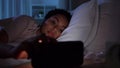 Sleeping woman awaking because of phone at night