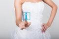 Technology, internet and networking concept. Beautiful bride in fashion wedding dress. Bride presses information button