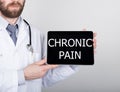 Technology, internet and networking in medicine concept - Doctor holding a tablet pc with chronic pain sign. Internet