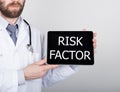 Technology, internet and networking in medicine concept - Doctor holding a tablet pc with risk factor sign. Internet Royalty Free Stock Photo