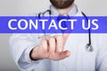 Technology, internet and networking in medicine concept - medical doctor presses contact us button on virtual screens Royalty Free Stock Photo