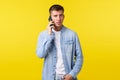 Technology, lifestyle and advertisement concept. Busy serious-looking man in casual clothes having important phone call Royalty Free Stock Photo